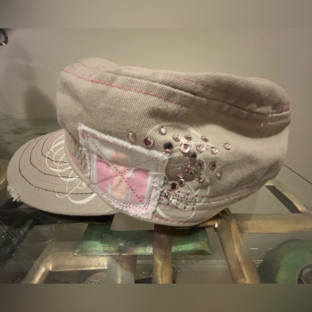 Pink, White and Tan Women’s Cap with Pink Sparkles. CNH America LLC